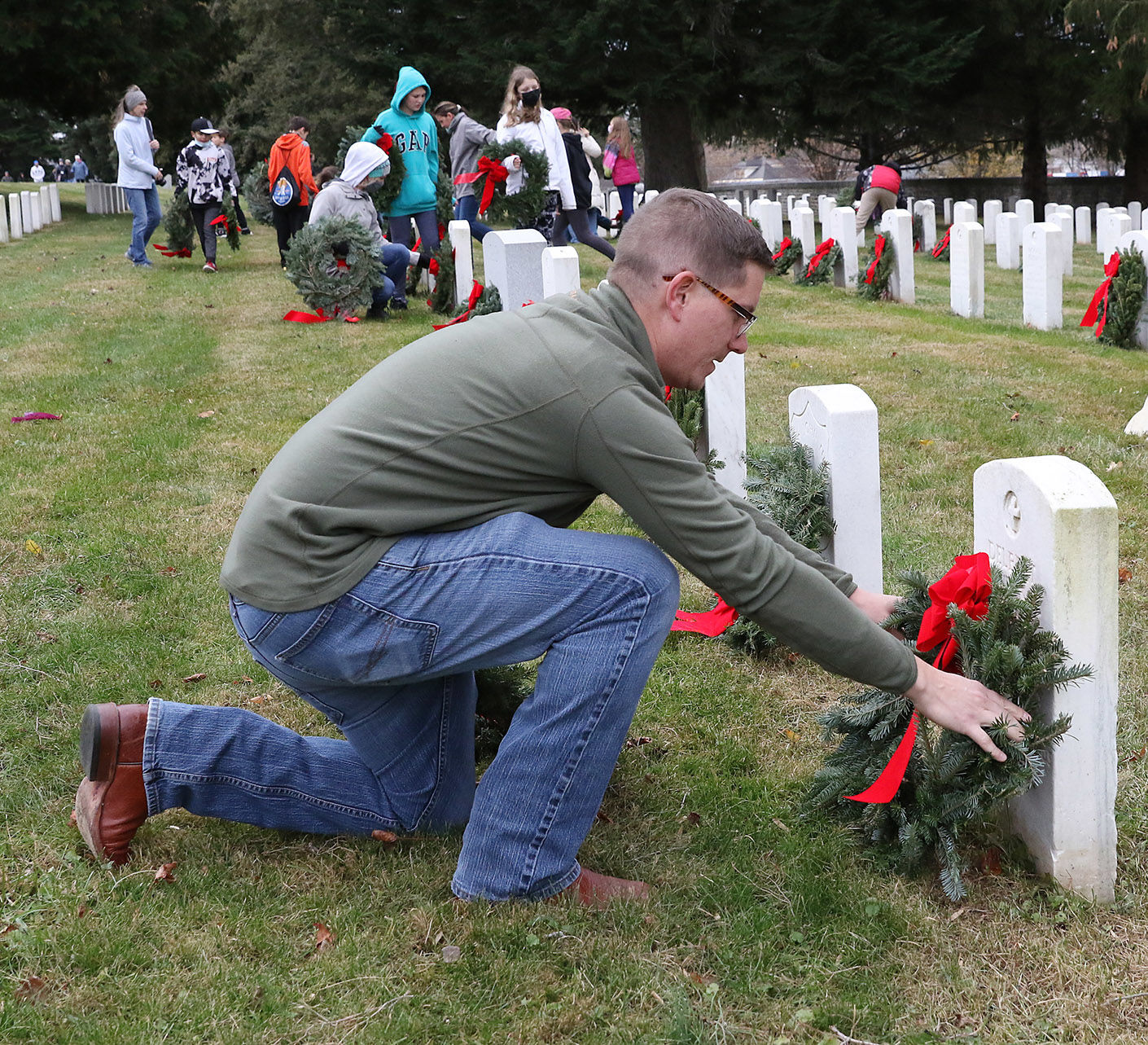 Torren Ecker places wreath